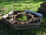 a planter that is in the middle of the grass