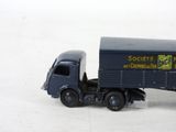 a toy truck that is sitting on a white surface
