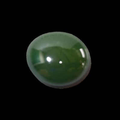 a picture of a green jade ball on a black background