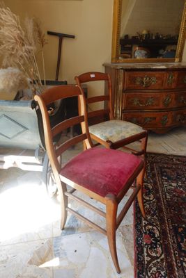 a chair that is sitting in a room with a rug on the floor