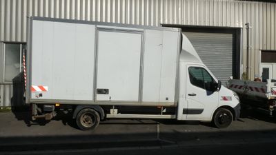 a truck that is parked in front of a building