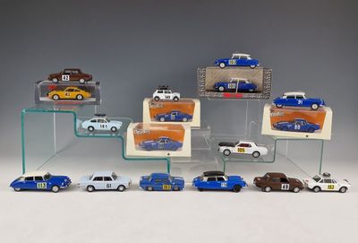 a lot of toy cars on display in a display case