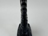a black object that looks like an elephant ' s foot