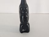 an image of a black sculpture of a man