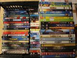 a lot of dvds stacked on top of each other