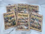 six comics are wrapped in plastic bags on a white surface