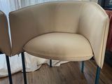 a chair that is sitting on the floor in front of a window