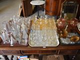 many glasses and trays on a table in a room