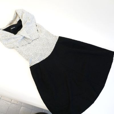 a black and white dress that is on a table