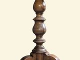 a wooden table with a candle holder on it