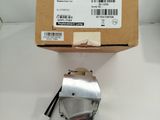 a box with a small metal object on top of it