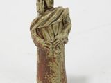 figurine of a woman holding a child in her arms
