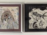 deux tableaux accrochés au mur au-dessus d'un lit