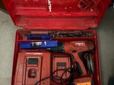 a red tool box with tools in it on the floor