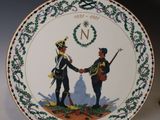 an image of a plate with a picture of two men shaking hands