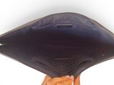 a person holding an empty wallet in their hand