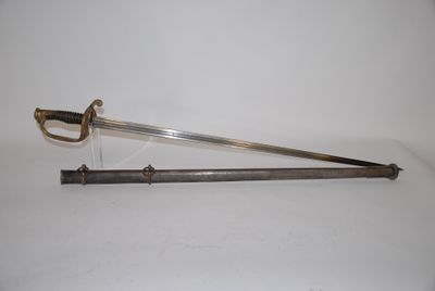 an old sword with a wooden handle on a white surface