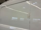 a close up of a white van door with a sticker on it