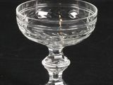 a close up of a clear glass bowl on a black background