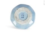 a blue and white bowl with a chinese writing on it