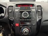 the dashboard of a car with a clock and radio in it