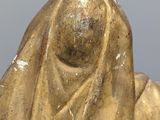 a statue of a woman with a veil on her head