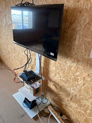 a flat screen tv mounted on a wall in a room