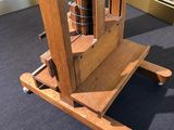 a clock that is sitting on a stand in a room