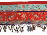 a red and blue rug with a red border on it