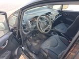 the interior of a small car with the door open