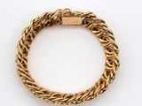 an image of a gold bracelet on a white background