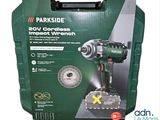 a green box with a black and white picture of a cordless drill