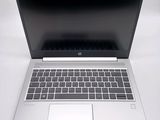 an open laptop computer sitting on top of a white table