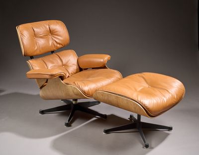 an image of a brown leather lounge chair and ottoman on a grey background