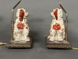 pair of antique porcelain dog lamps with red and white paint
