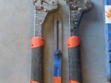 three tools that are sitting on a table