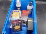 a blue container with a lot of items inside of it