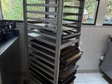 an image of a commercial kitchen with a rack of trays