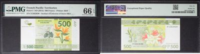 four different types of currency are displayed on a display case