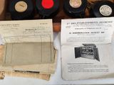 a box with a bunch of old records on it