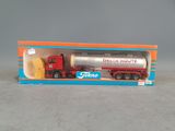 a toy truck that is in a box on a table