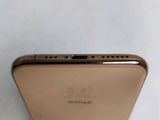 the back of a gold iphone 6g with a camera on top of it