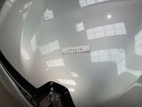 a close up of the hood of a car with a sticker on it