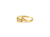 a close up of a gold ring with diamonds on a white background