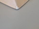 a wooden block on a table with a knife in it