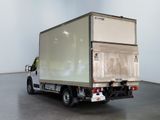a white truck that is parked in a room