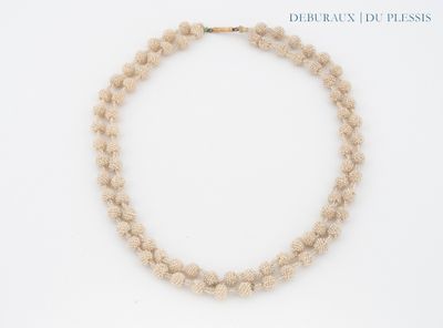 necklace made of natural stone beads with a gold clasp on a white background