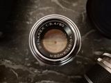a close up view of a camera lens and a pair of shoes
