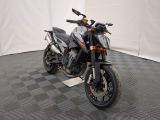 a motorcycle that is parked in a room with a checkered floor
