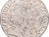 an old silver coin with a crown on top of it